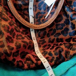 Cynthia Rowley large, slouchy animal fur, animal print.  Check the pictures.